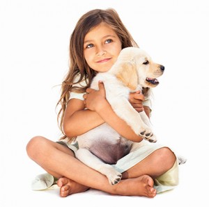 girl holding puppy thinking about lawn care in Collierville