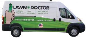 The lawn doctor van with logo on the side and service mentioned for your Lawn Care